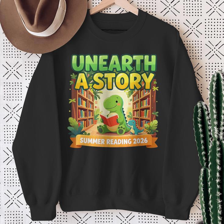 Unearth A Story Dinosaur Summer Reading 2026 Books Sweatshirt Gifts for Old Women