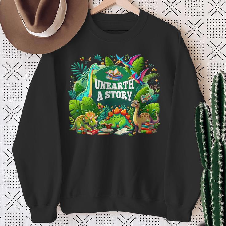 Unearth a Story Library Summer Reading 2026 Dinosaur Book Sweatshirt Gifts for Old Women Unearth a Story Library Summer Reading 2026 Dinosaur Book Sweatshirt Gifts for Old Women