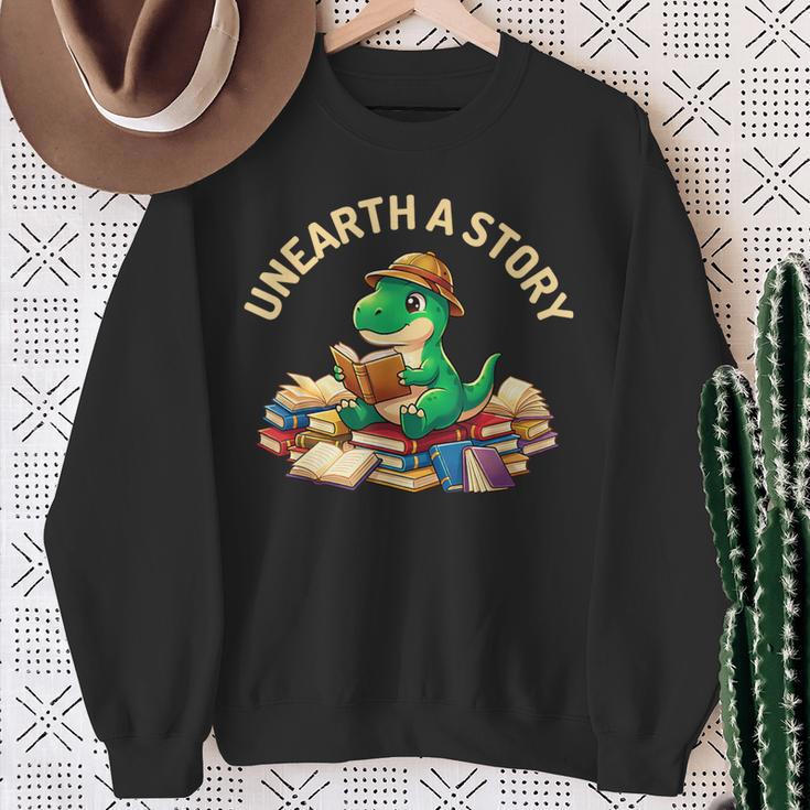 Unearth A Story Summer Reading 2026 Dinosaur Book Floral Sweatshirt Gifts for Old Women Unearth A Story Summer Reading 2026 Dinosaur Book Floral Sweatshirt Gifts for Old Women