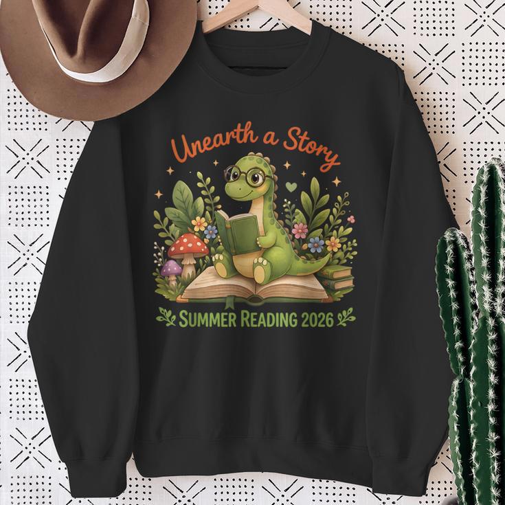 Unearth A Story Summer Reading 2026 Dinosaur Reading Books Sweatshirt Gifts for Old Women
