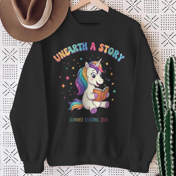 Unicorn Reading a Book Unearth a Story Program 2026 Sweatshirt Gifts for Old Women Unicorn Reading a Book Unearth a Story Program 2026 Sweatshirt Gifts for Old Women