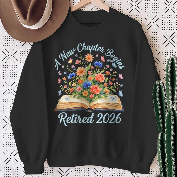 Women's New Chapter Begins Retired 2026 Watercolor Floral Book Women Sweatshirt Gifts for Old Women
