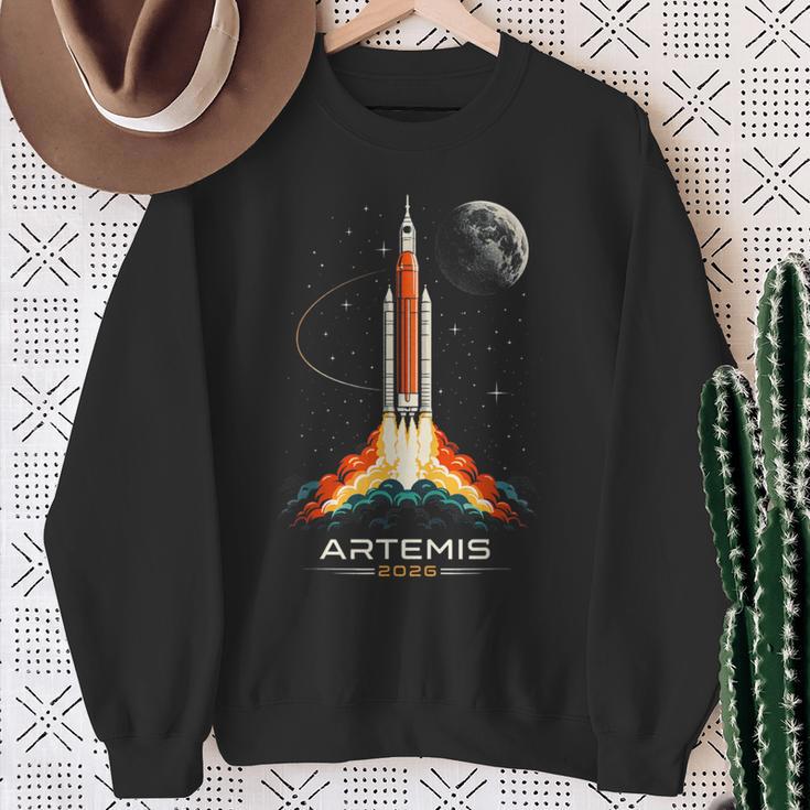 アルテミスii宇宙ロケット打ち上げミッショントゥザムーンアルテミス2 スウェットシャツ 年配の女性への贈り物