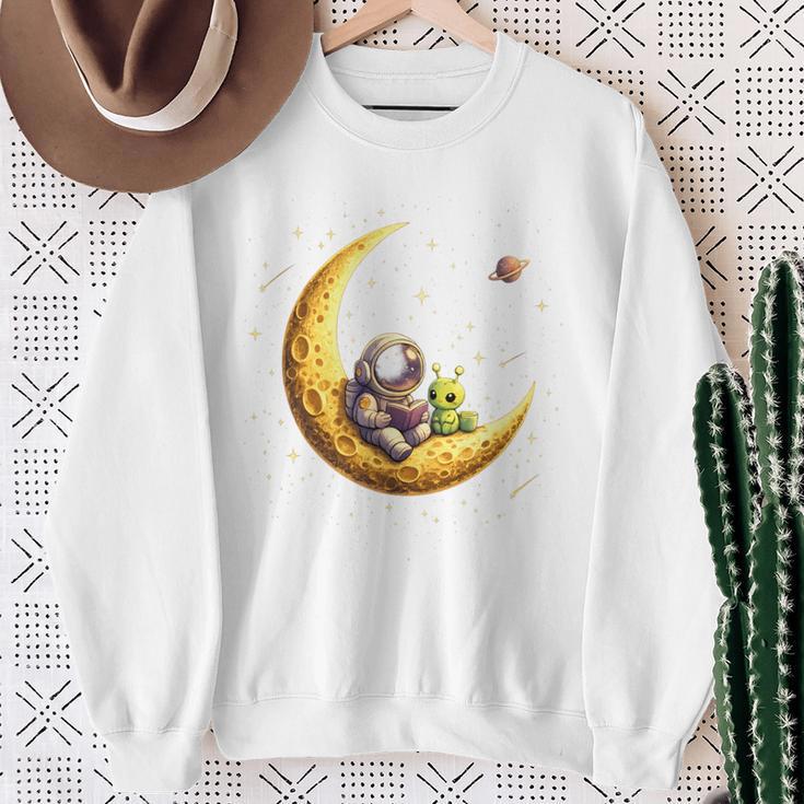 Astronaut Reading Book To Alien Moon Space Astronomy Sweatshirt Gifts for Old Women