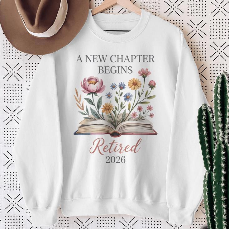 Retired 2026 Teacher Women A New Chapter Begins Floral Book Sweatshirt Gifts for Old Women