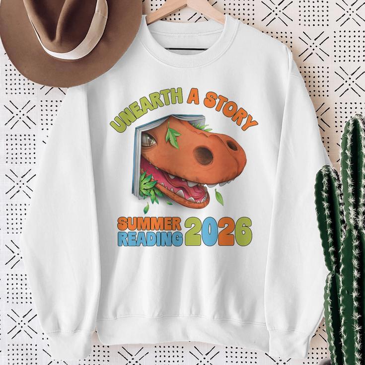 Unearth A Story Summer Reading 2026 Dinosaur Book Lover Dino Premium Tri-Blend Sweatshirt Gifts for Old Women