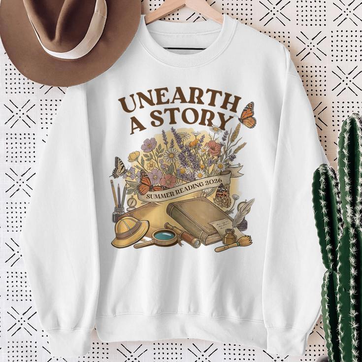 Unearth A Story Summer Reading 2026 Flower Butterfly Book Sweatshirt Gifts for Old Women Unearth A Story Summer Reading 2026 Flower Butterfly Book Sweatshirt Gifts for Old Women