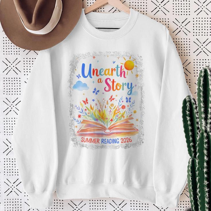 Unearth a Story Summer Reading 2026 Wildflower Book Library Sweatshirt Gifts for Old Women Unearth a Story Summer Reading 2026 Wildflower Book Library Sweatshirt Gifts for Old Women
