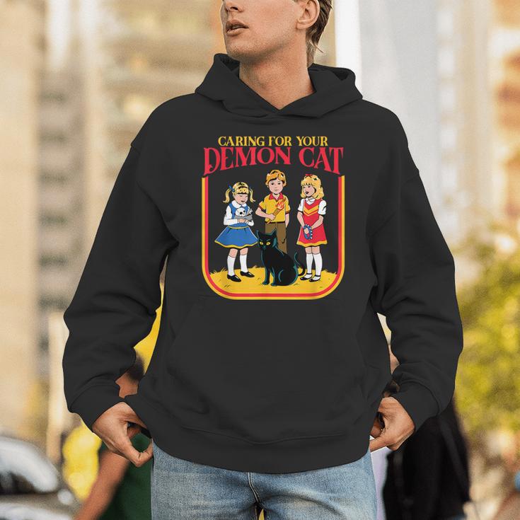 Caring For Your Evil Cat Retro Dark Humor Book Cover Unisex Hoodie