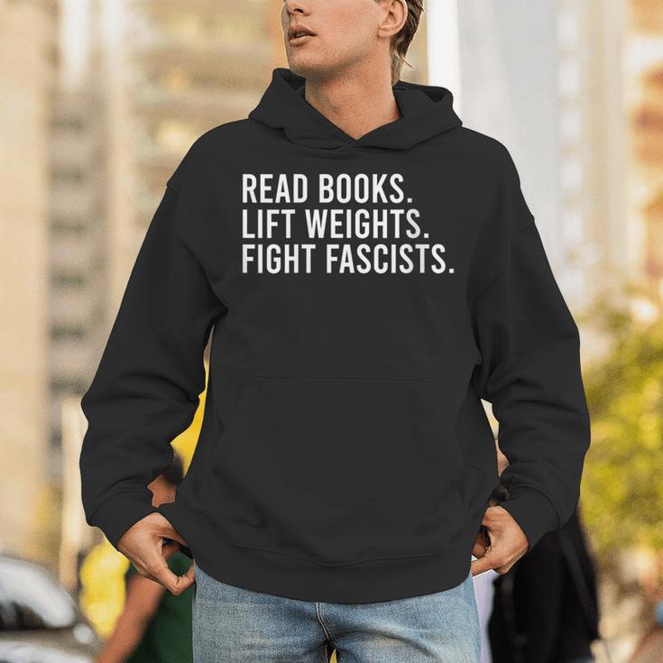Women's Read Books Lift Weights Fight Fascists Reading Activism Unisex Hoodie