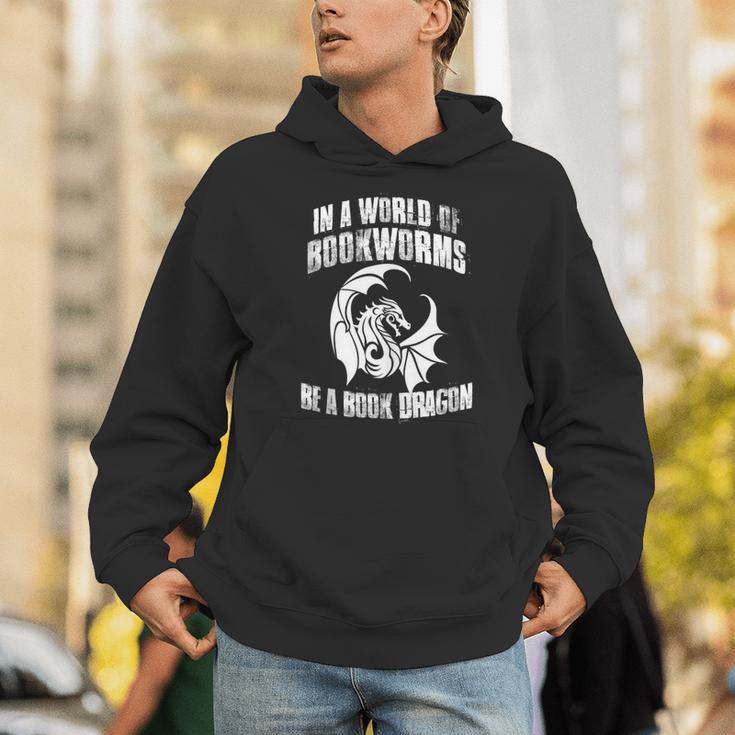 In A World Of Bookworms Be A Book Dragon Inspirational Unisex Hoodie In A World Of Bookworms Be A Book Dragon Inspirational Unisex Hoodie