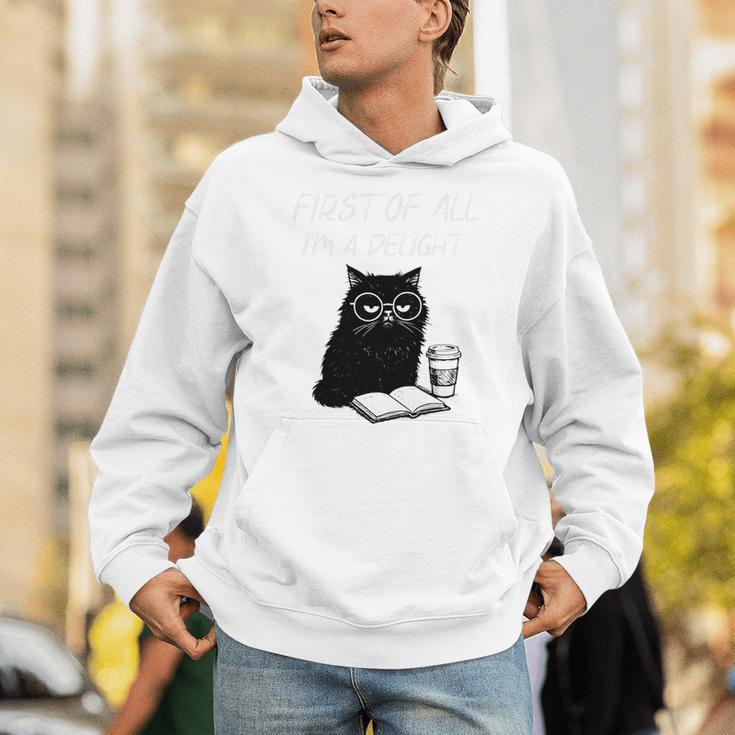 First Of All I’m A Delight Cute Cat Books Coffee Humor Unisex Hoodie First Of All I’m A Delight Cute Cat Books Coffee Humor Unisex Hoodie