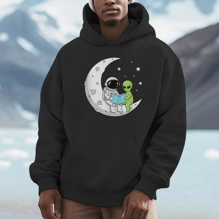 Astronaut And Alien Reading On Moon Space Book Lover Sci Fi Unisex Hoodie Astronaut And Alien Reading On Moon Space Book Lover Sci Fi Unisex Hoodie