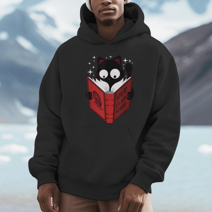 Cat Reads Book How To Live With Humans Unisex Hoodie