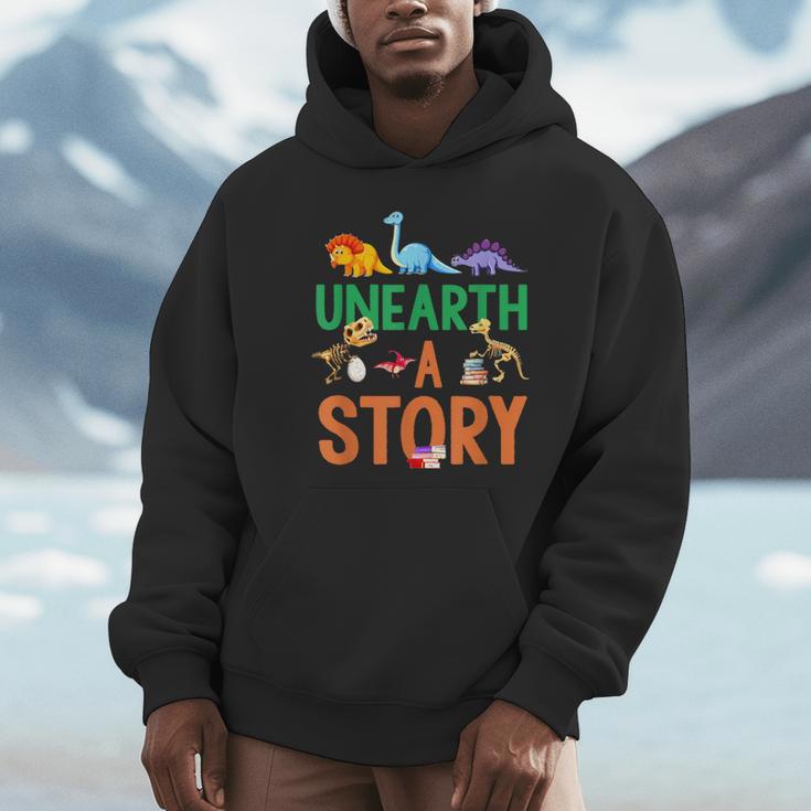 Summer Reading 2026 Dinosaurs Book Lover Unearth A Story Unisex Hoodie