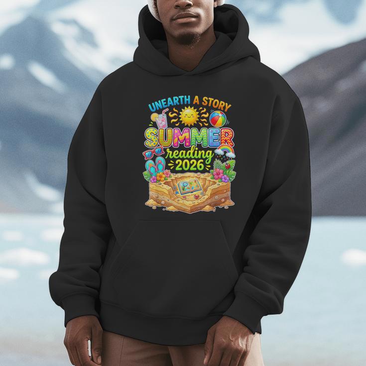 Summer Reading 2026 Unearth a Story Book Reading Unisex Hoodie Summer Reading 2026 Unearth a Story Book Reading Unisex Hoodie