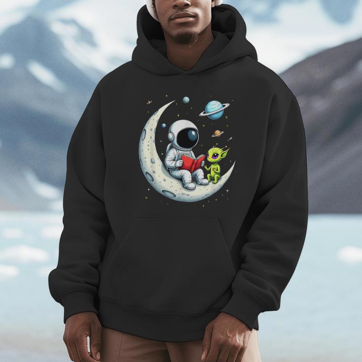 UFO Alien Astronaut Reading Book In Space Unisex Hoodie UFO Alien Astronaut Reading Book In Space Unisex Hoodie