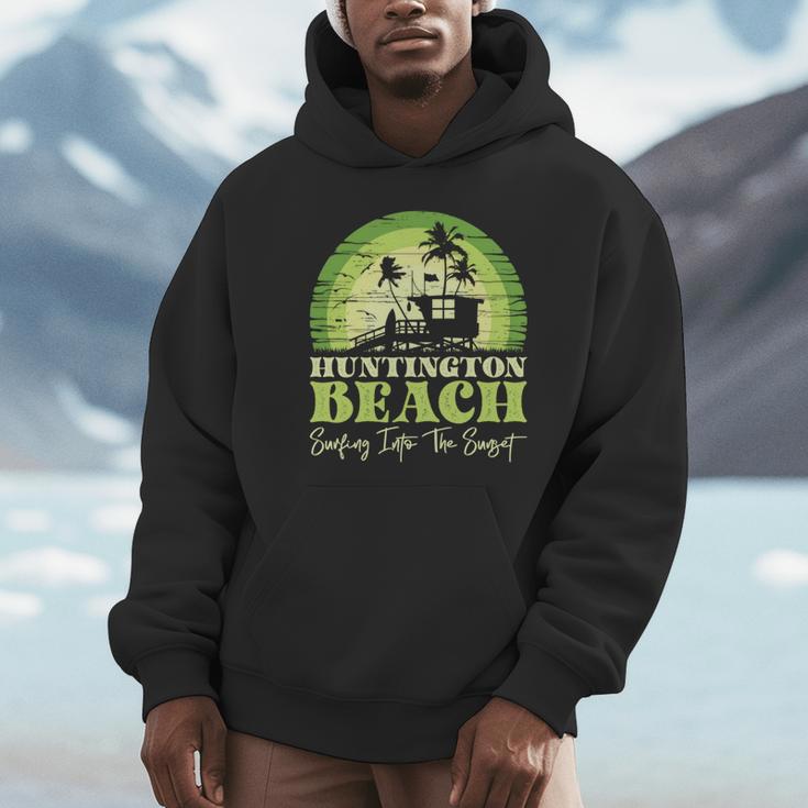 レトロなハンティントンビーチサンセットサーフシーン 長袖tシャツ パーカー