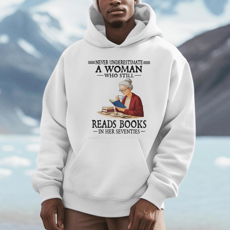 Never Underestimate A Woman Who Still Reads Books In Her Unisex Hoodie Never Underestimate A Woman Who Still Reads Books In Her Unisex Hoodie