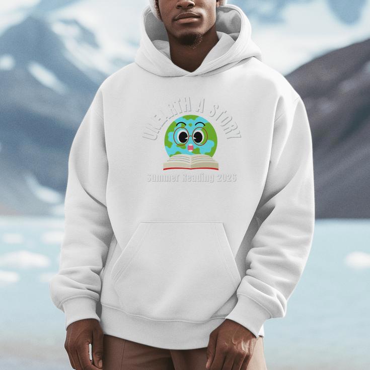 Unearth a Story Summer 2026 Reading Program Earth Read Book Premium Tri-Blend Unisex Hoodie