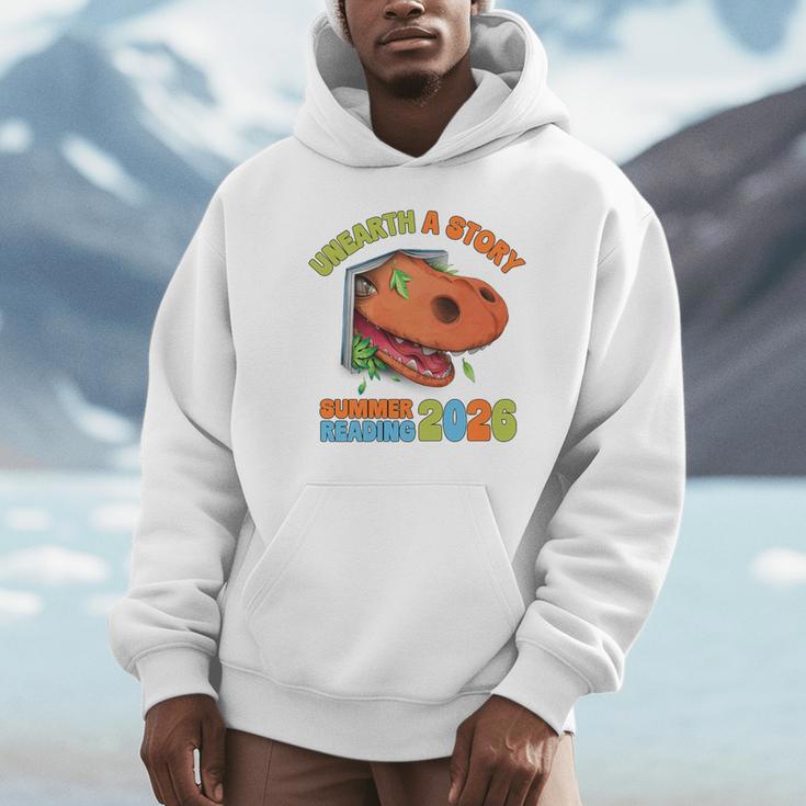 Unearth A Story Summer Reading 2026 Dinosaur Book Lover Dino Premium Tri-Blend Unisex Hoodie Unearth A Story Summer Reading 2026 Dinosaur Book Lover Dino Premium Tri-Blend Unisex Hoodie