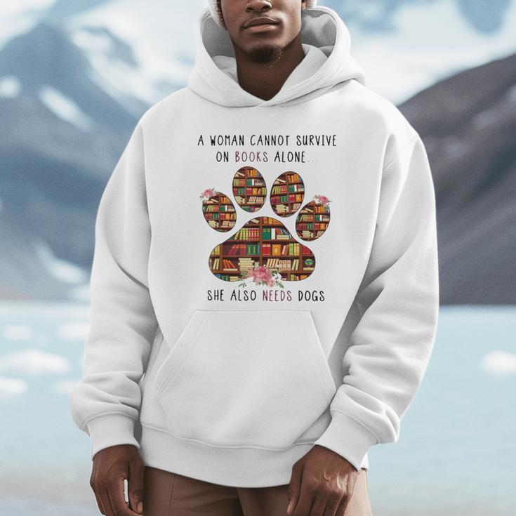 A Woman Cannot Survive On Books Alone She Also Needs Dog Unisex Hoodie A Woman Cannot Survive On Books Alone She Also Needs Dog Unisex Hoodie
