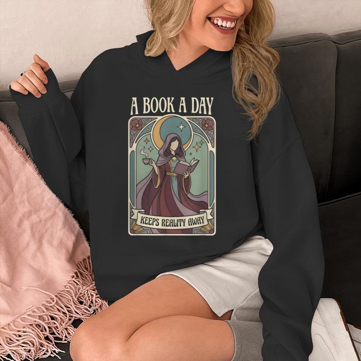 A Book a Day Keeps Reality Away Fairy Reading Tarot Card Unisex Hoodie A Book a Day Keeps Reality Away Fairy Reading Tarot Card Unisex Hoodie