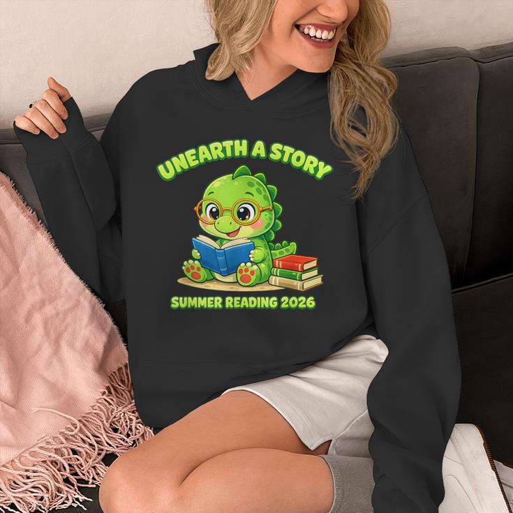 Cute Dino Book Lover Unearth A Story Summer Reading Unisex Hoodie Cute Dino Book Lover Unearth A Story Summer Reading Unisex Hoodie