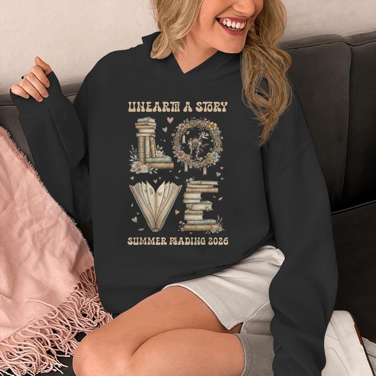Love Unearth a Story Summer Reading 2026 Dino Skeleton Book Unisex Hoodie Love Unearth a Story Summer Reading 2026 Dino Skeleton Book Unisex Hoodie