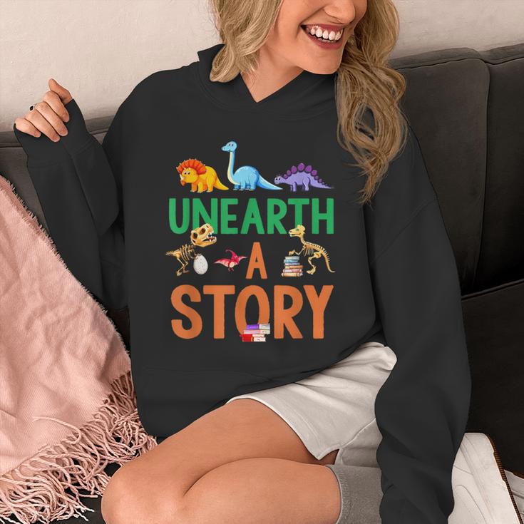 Summer Reading 2026 Dinosaurs Book Lover Unearth A Story Unisex Hoodie