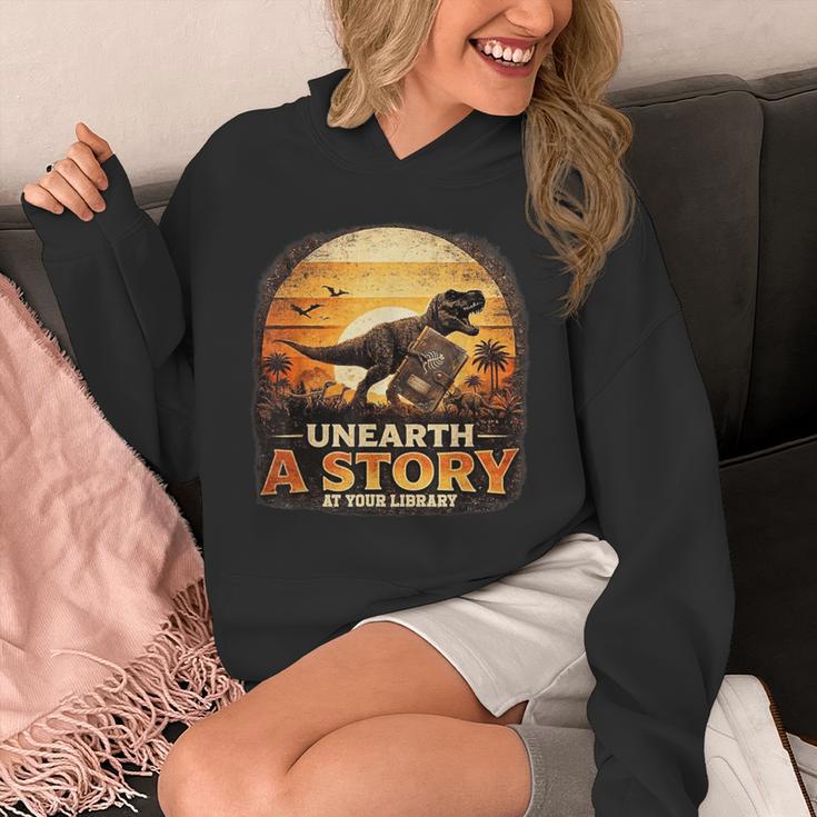Unearth Story Summer Reading 2026 Dinosaurs Library Reading Unisex Hoodie Unearth Story Summer Reading 2026 Dinosaurs Library Reading Unisex Hoodie