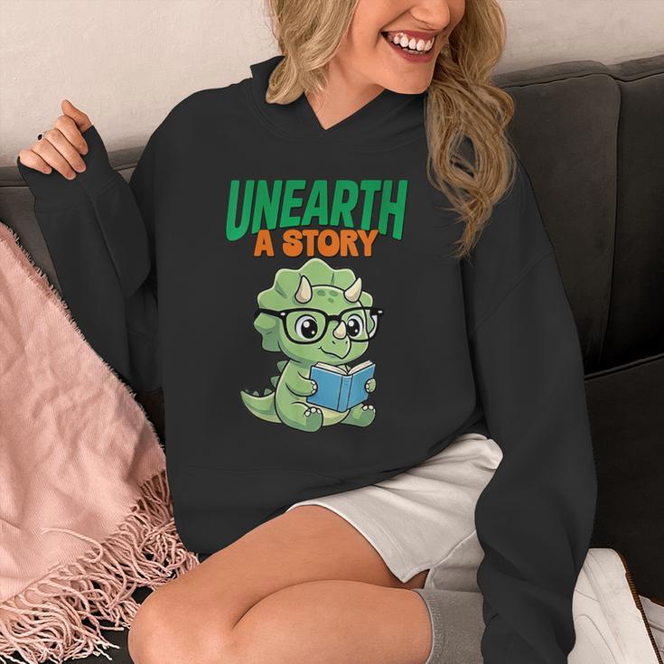 Women's Unearth a Story Summer Reading 2026 Triceratops Dino Book Unisex Hoodie