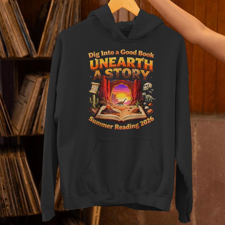 Books Summer Reading 2026 Unearth A Story Dinosaur Unisex Hoodie