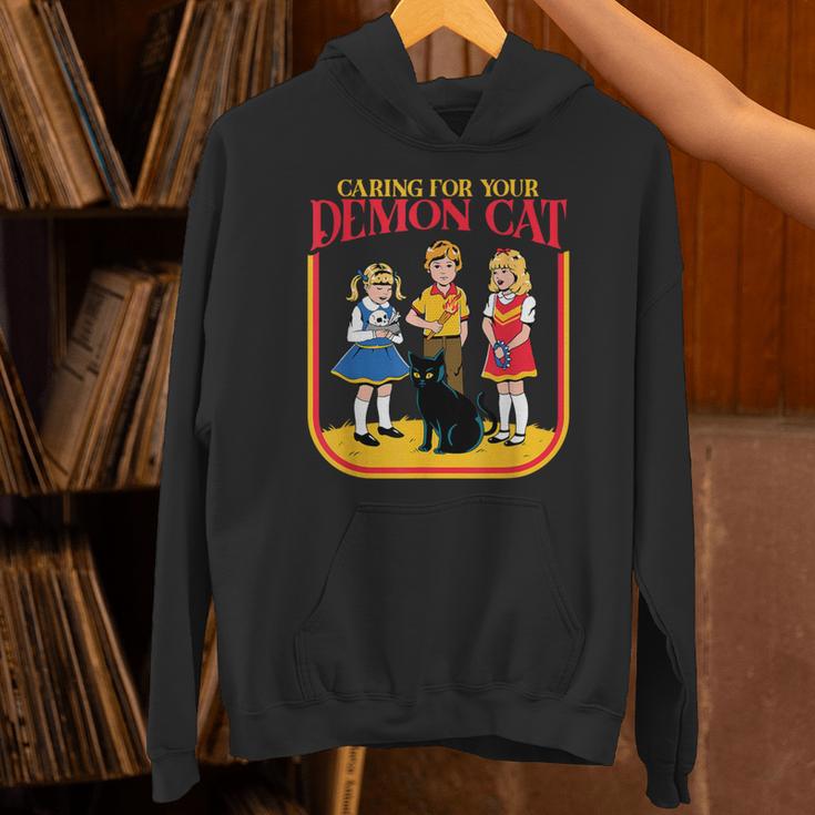Caring For Your Evil Cat Retro Dark Humor Book Cover Unisex Hoodie