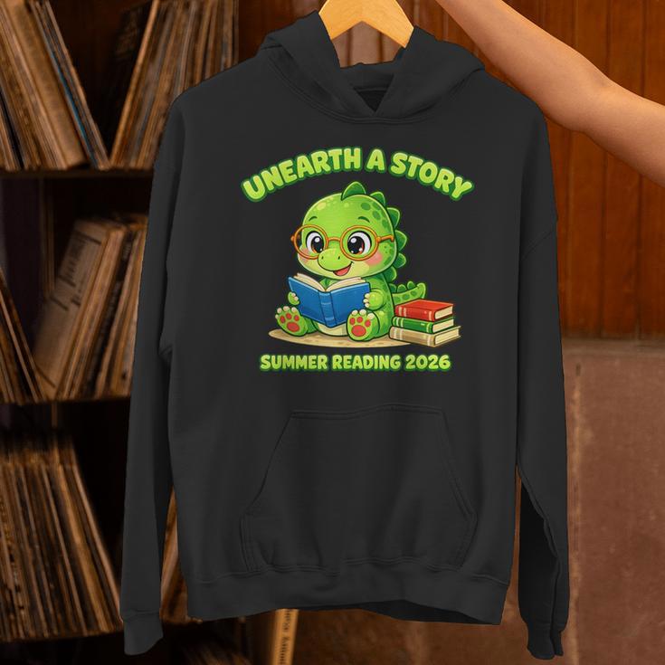 Cute Dino Book Lover Unearth A Story Summer Reading Unisex Hoodie Cute Dino Book Lover Unearth A Story Summer Reading Unisex Hoodie