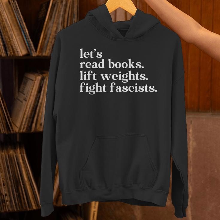 Let's Read Books Lift Weights Fight Fascists Unisex Hoodie