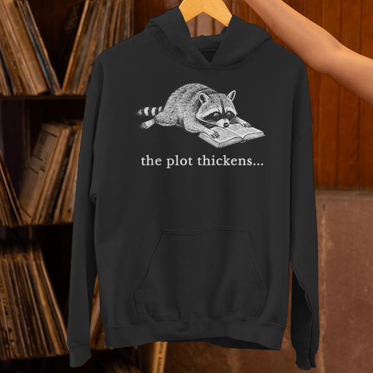 The Plot Thickens Raccoon Book Lover Unisex Hoodie The Plot Thickens Raccoon Book Lover Unisex Hoodie