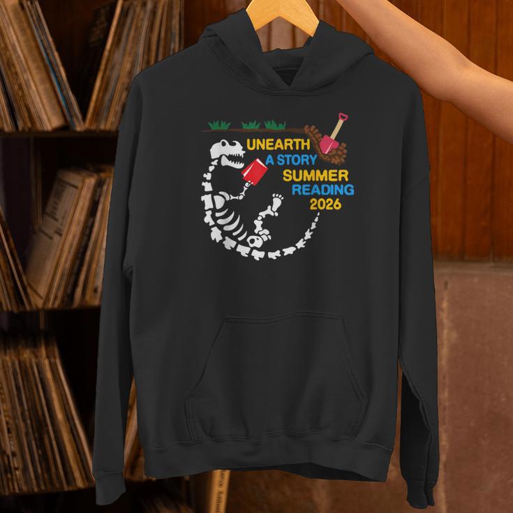 Unearth a Story T-Rex Reading a Book Summer Reading 2026 Unisex Hoodie