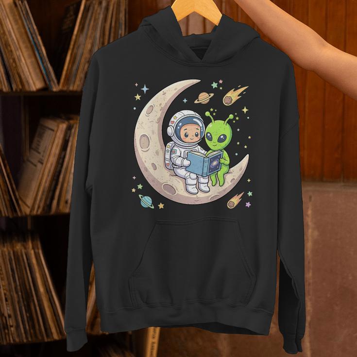 Women's Astronaut Reading Book With Alien Moon Space Astronomy Unisex Hoodie