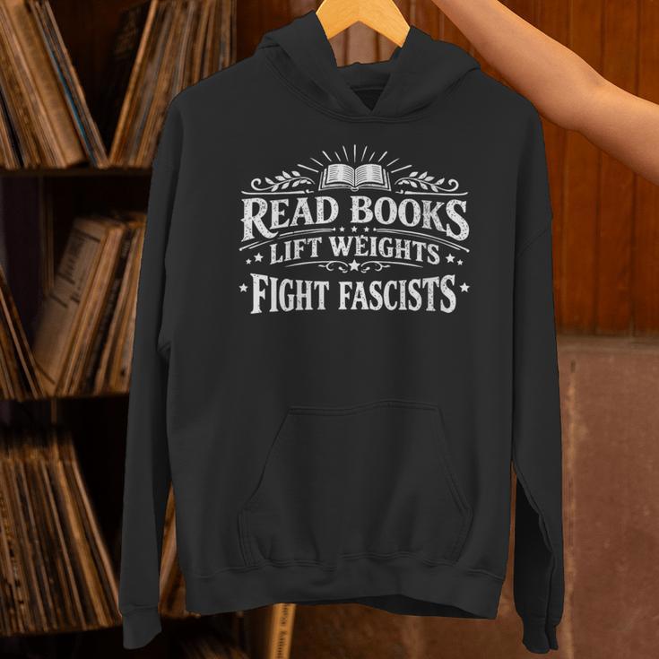 Women's Read Books Lift Weights Fight Fascists Reading Meme Unisex Hoodie Women's Read Books Lift Weights Fight Fascists Reading Meme Unisex Hoodie