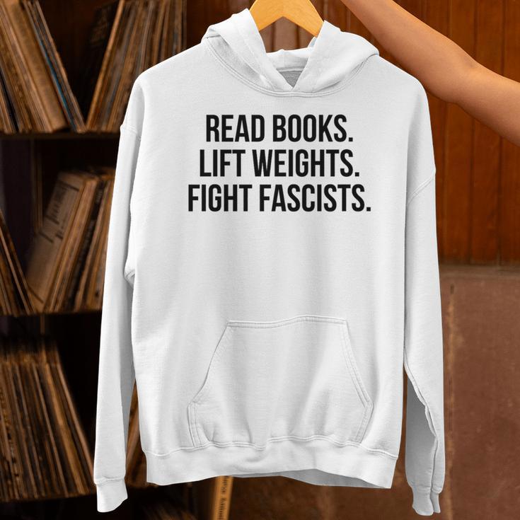 Read Books Lift Weights Fight Fascists Premium Tri-Blend Unisex Hoodie