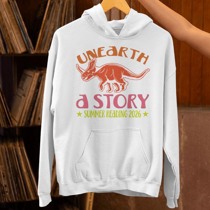 Unearth a Story Summer Reading 2026 Triceratops Dino Book Unisex Hoodie