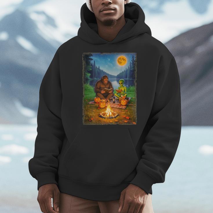 Bigfoot And Alien Reading Books Campfire Halloween Men Hoodie Bigfoot And Alien Reading Books Campfire Halloween Men Hoodie