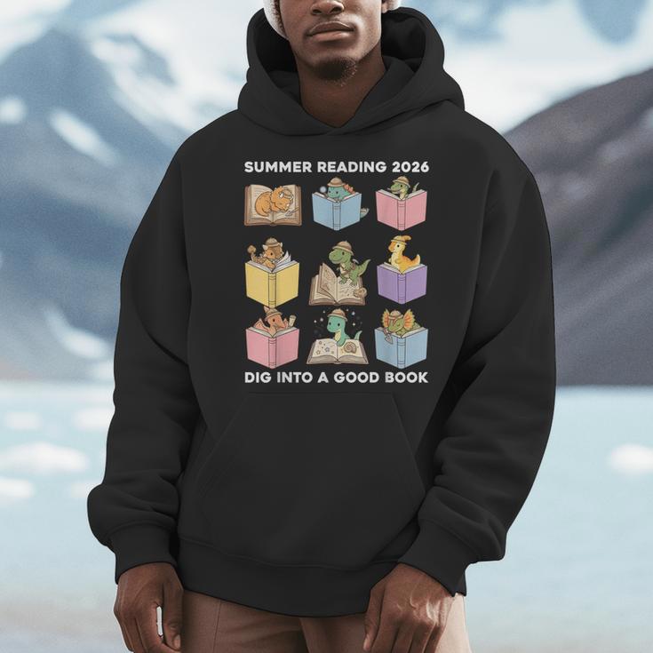 Summer Reading 2026 Unearth A Story Dinosaur Books Readers Men Hoodie