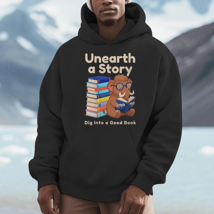 Women's Unearth A Story Reading Mammoth Prehistoric Book Librarian Men Hoodie Women's Unearth A Story Reading Mammoth Prehistoric Book Librarian Men Hoodie