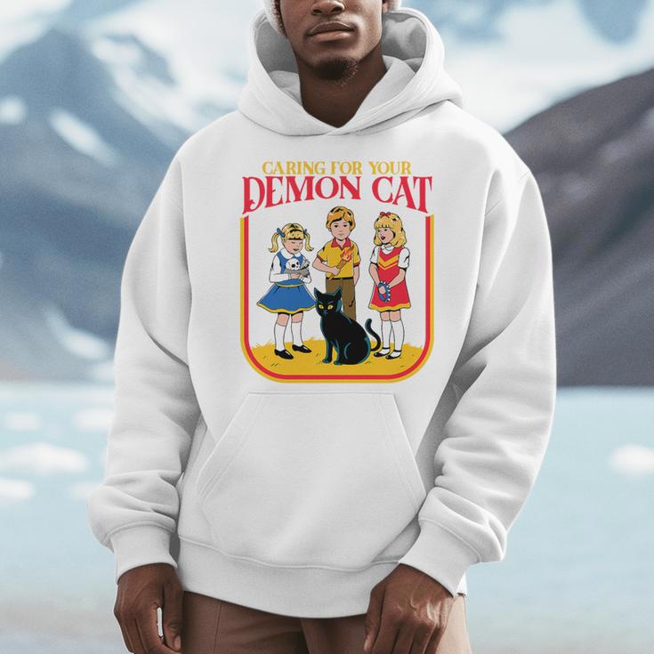 Caring For Your Evil Cat Retro Dark Humor Book Cover Premium Tri-Blend Men Hoodie Caring For Your Evil Cat Retro Dark Humor Book Cover Premium Tri-Blend Men Hoodie