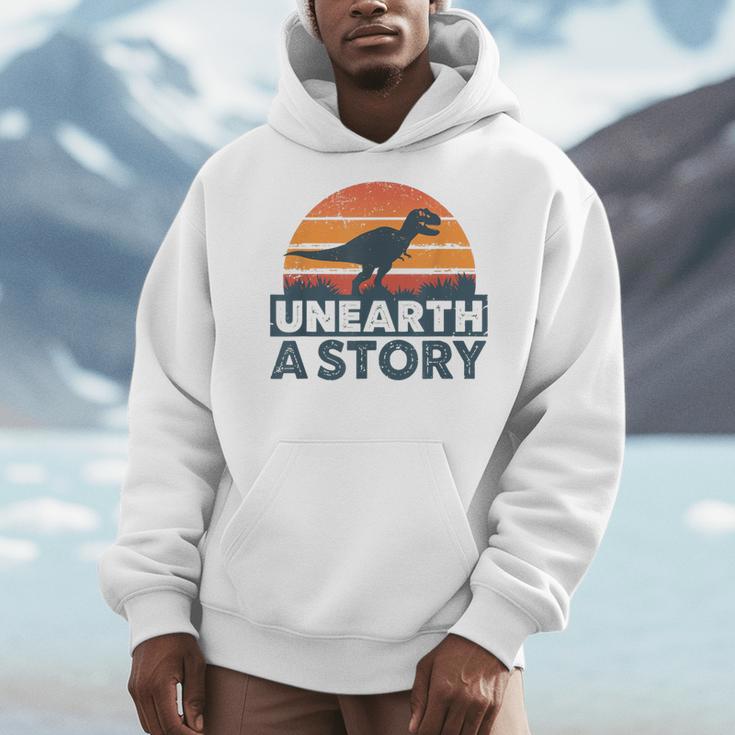 Unearth A Story Dinosaur Reader Book Lover 2026 Men Hoodie