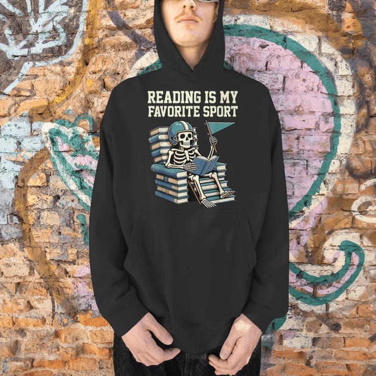Football Skeleton Reading On Book Stack Men Hoodie