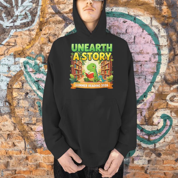 Unearth A Story Dinosaur Summer Reading 2026 Books Men Hoodie Unearth A Story Dinosaur Summer Reading 2026 Books Men Hoodie