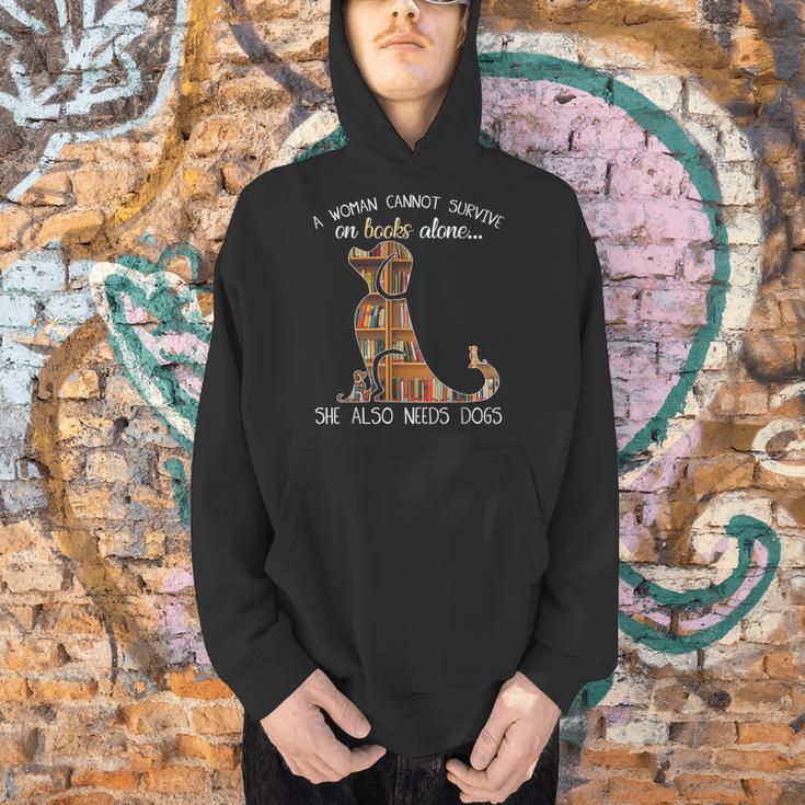 A Woman Cannot Survive On Books Alone She Also Needs Dogs Men Hoodie A Woman Cannot Survive On Books Alone She Also Needs Dogs Men Hoodie